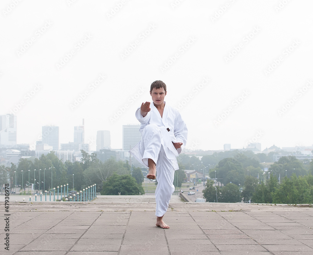 Young karate master doing exercise in the morning Young karate master doing exercise in the morning