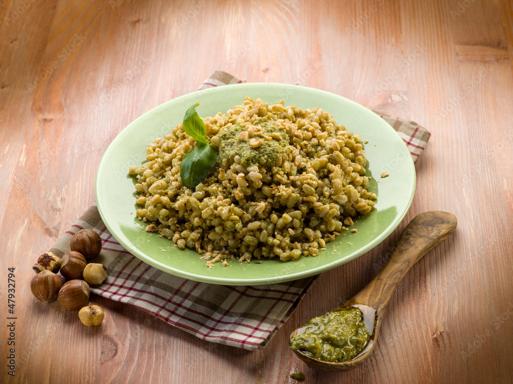 spelt with pesto sauce and hazel nut, vegetarian food spelt with pesto sauce and hazel nut, vegetarian food