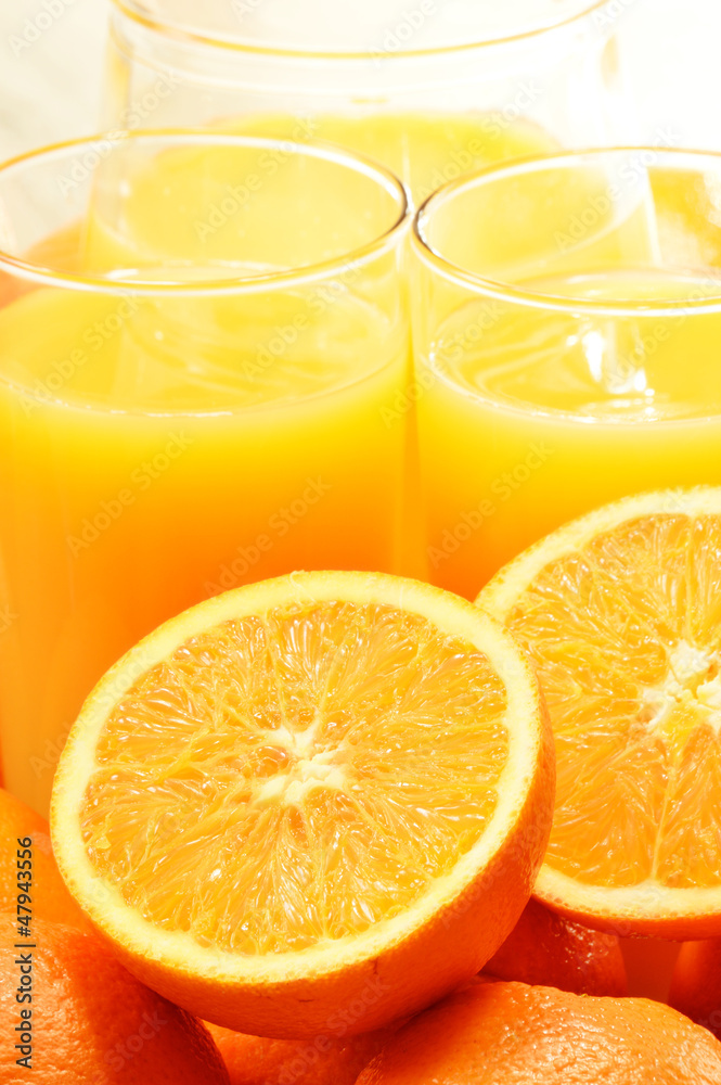 Composition with two glasses of orange juice and fruits Composition with two glasses of orange juice and fruits