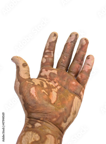 Muddy hands on a white background.