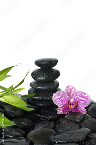 Spa Still life with tower stone on pebble and green leaf