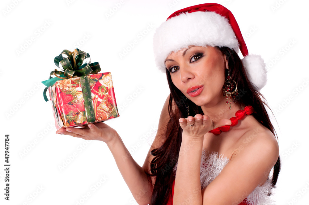 .Beautiful brunette Santa Girl holding a gift box and sends a ki .Beautiful brunette Santa Girl holding a gift box and sends a ki