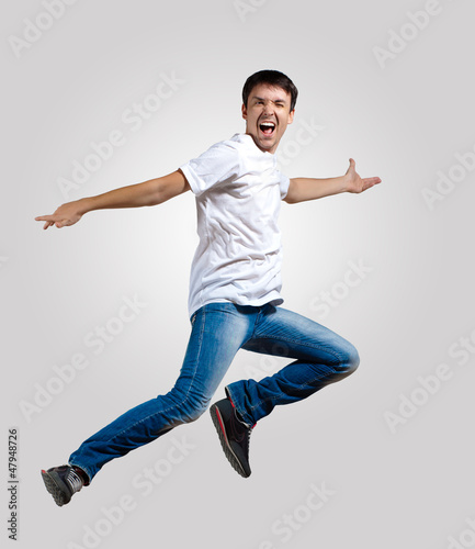 Young man dancing and jumping