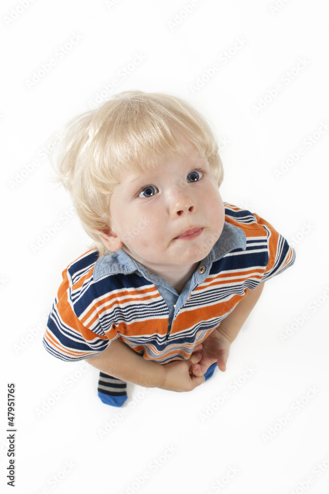 Adorable blonde hair and blue eyes baby boy looks up Adorable blonde hair and blue eyes baby boy looks up