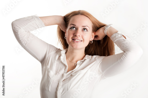 Brunette with her hair on a light background