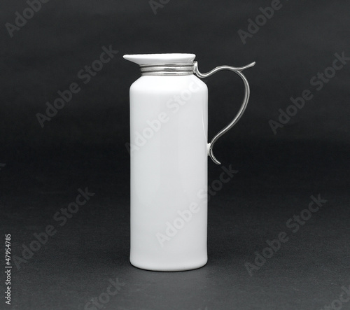A porcelain pitcher for milk, syrup or water