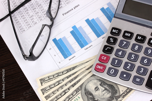 Documents, money and glasses close-up photo