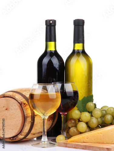 Barrel, bottles and glasses of wine, cheese and grapes,