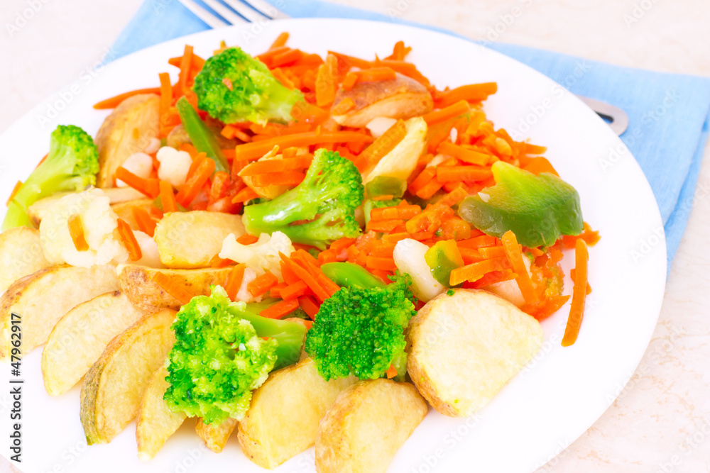 Mixed vegetables on a plate with fork Mixed vegetables on a plate with fork