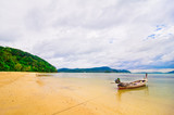 Tropical beach with trditional Thai boat
