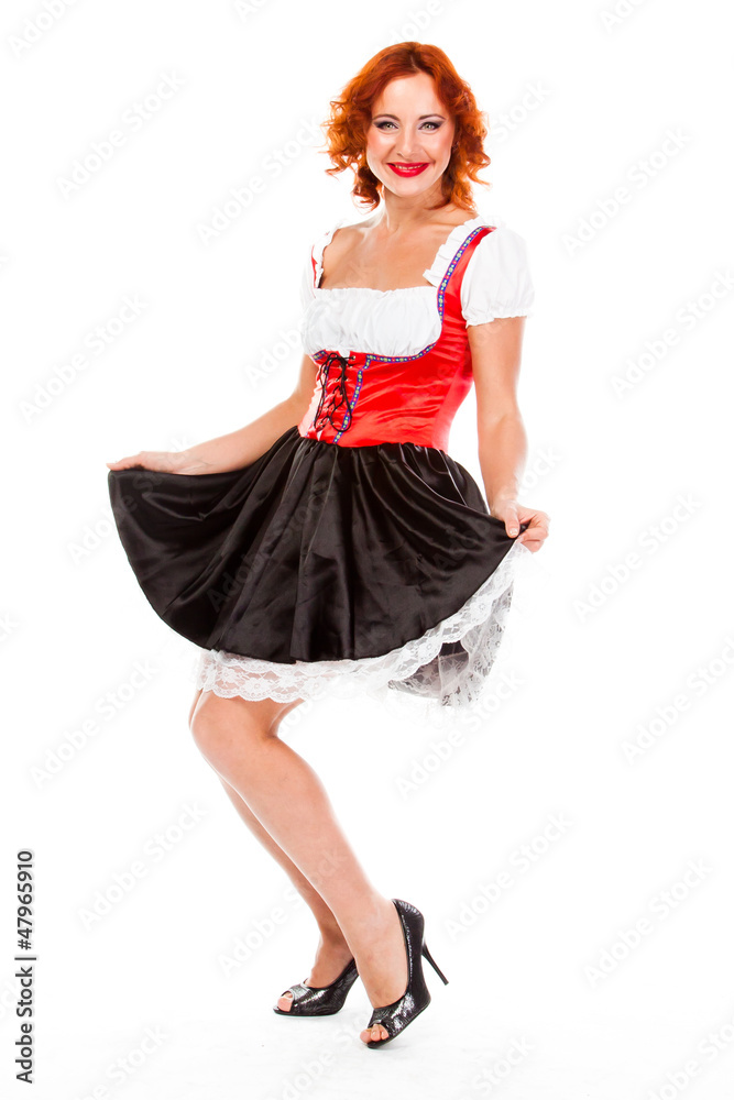 young and beautiful woman in a traditional Bavarian dress young and beautiful woman in a traditional Bavarian dress