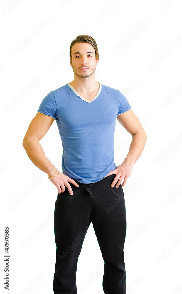 Handsome young man, muscular build, standing on white Handsome young man, muscular build, standing on white