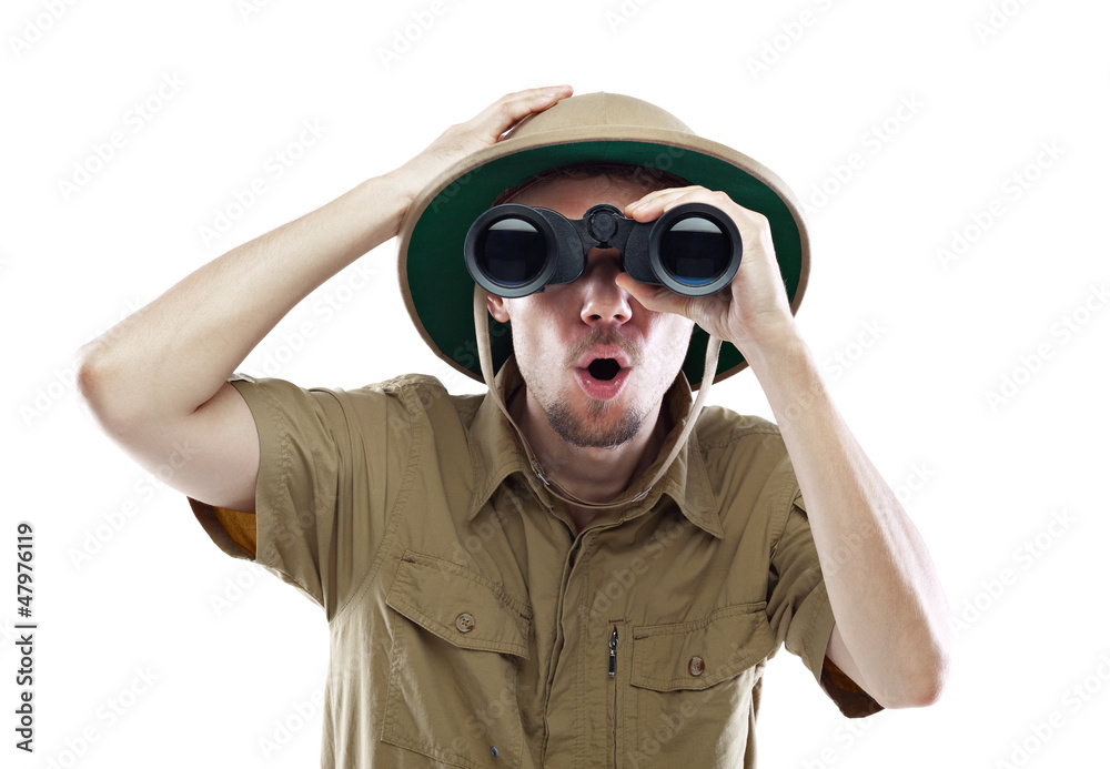 Amazed explorer looking through binoculars