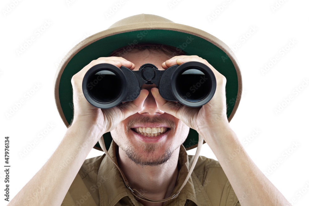 Happy explorer looking through binoculars