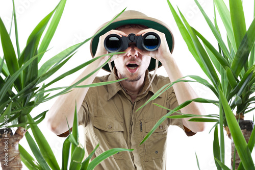 Explorer looking through binoculars