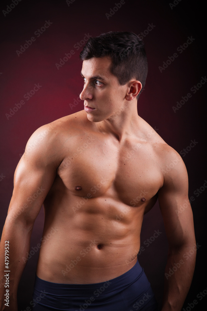 Image of a handsome athletic man on black background Image of a handsome athletic man on black background