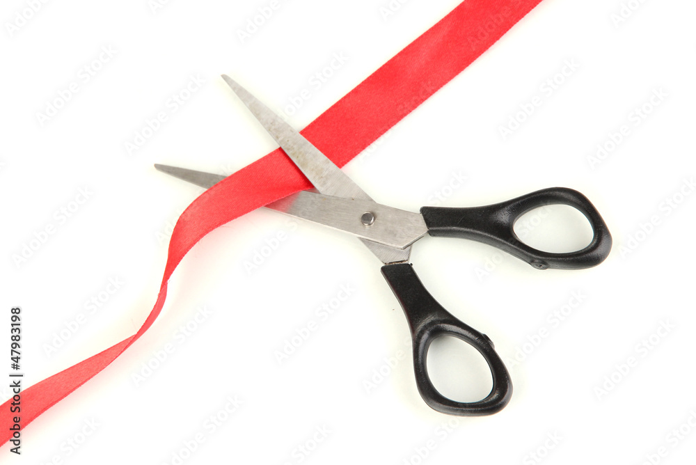 Cutting red ribbon isolated on white