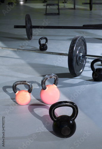 Kettlebells at crossfit gym with lifting bars © lunamarina