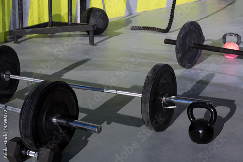 Kettlebells at crossfit gym with lifting bar weights