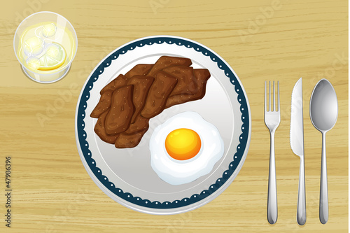 A meat and an omelet in a dish