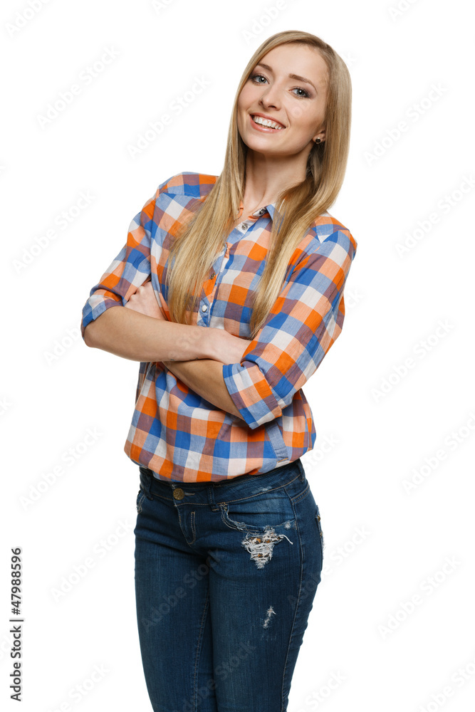 Young smiling female standing with hands folded Young smiling female standing with hands folded