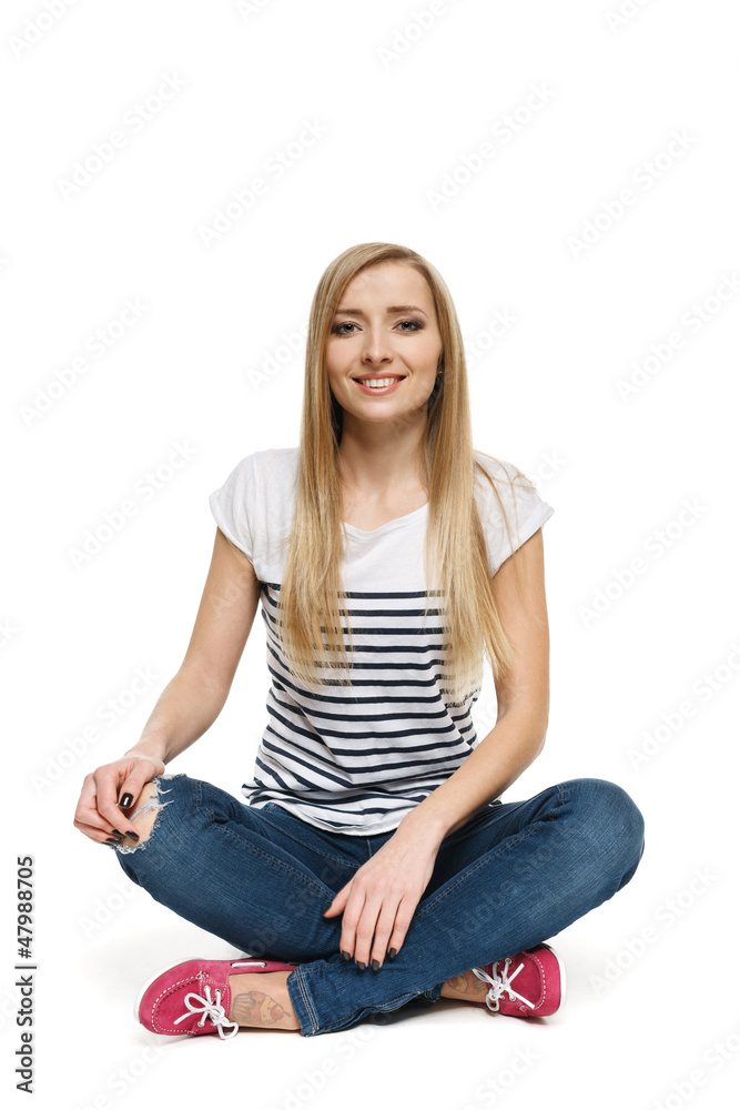 Happy female sitting crossed legs on the floor Happy female sitting crossed legs on the floor
