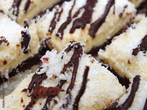 Pieces of coconut cream cake with chocolate