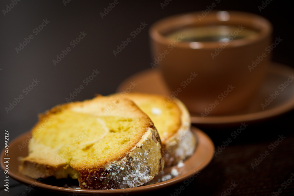 Round cake slice with sugar top and coffee. Traditional cuisine. Round cake slice with sugar top and coffee. Traditional cuisine.