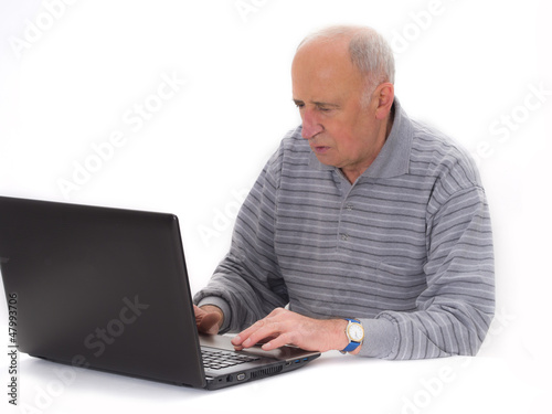 senior man with laptop isolated on the white
