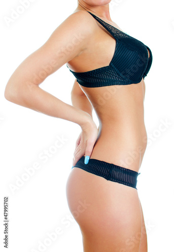 Sexual female body in black lingerie. Isolated on white