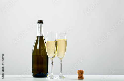 Bottle of champagne and two glasses