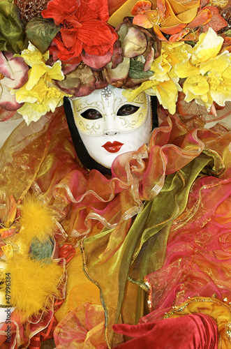 Fototapeta Naklejka Na Ścianę i Meble -  Person in Venetian costume attends Carnival of Venice.