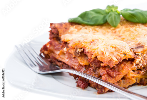 Piece of Lasagne isolated on white