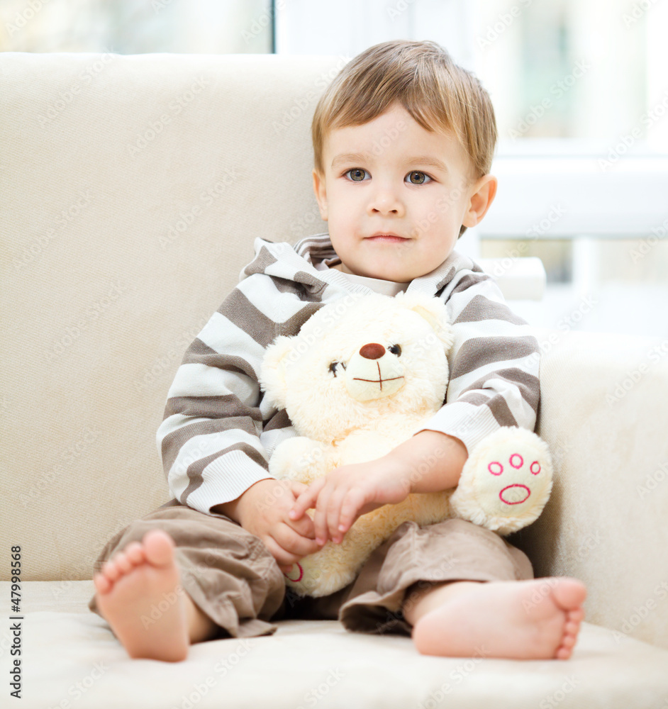 Portrait of a little boy with his teddy bear Portrait of a little boy with his teddy bear