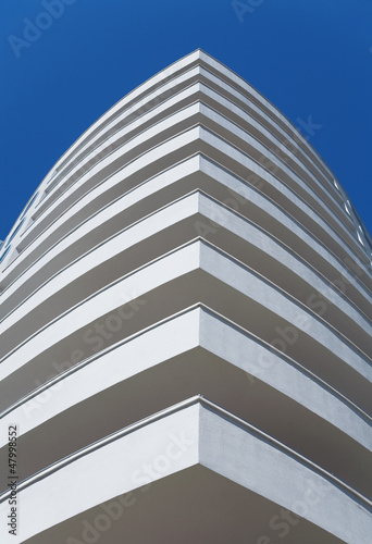 white balconies of a modern...