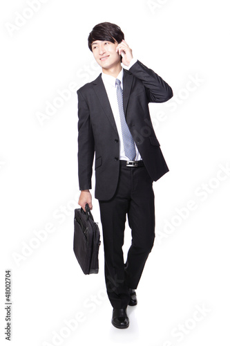 Business man Walking and speaking mobile phone