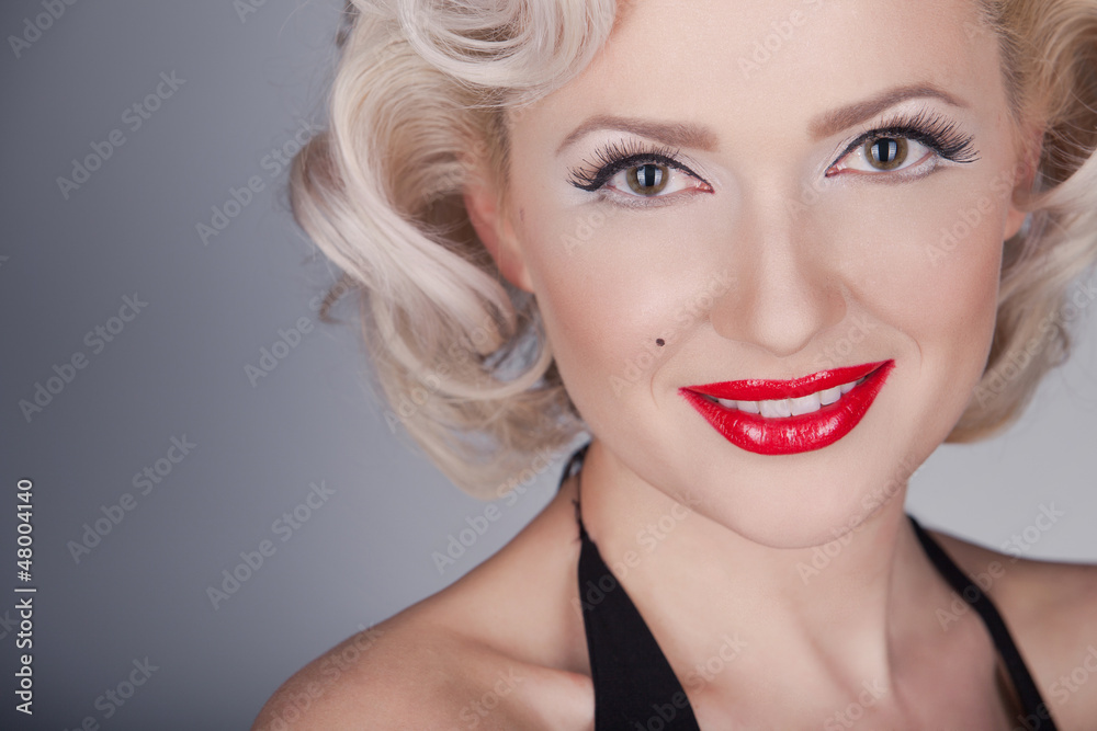 Pretty blond girl model like Marilyn Monroe in black dress with Pretty blond girl model like Marilyn Monroe in black dress with