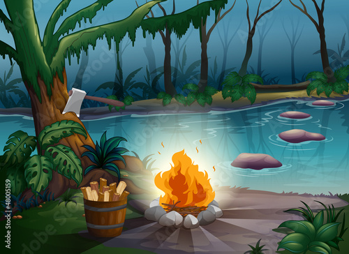 A river and a camp fire in a jungle
