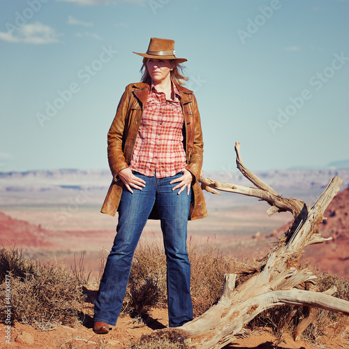 blond cowgirl in the desert photo