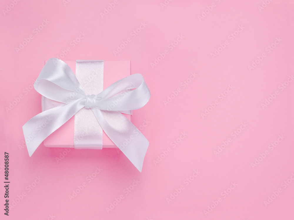 Pink Valentines Day gift box tied white satin ribbon bow