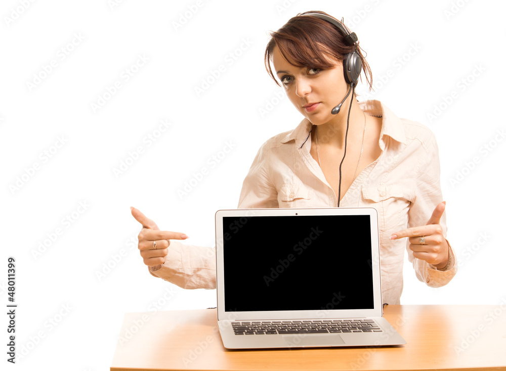 Woman wearing a headset pointing to her laptop Woman wearing a headset pointing to her laptop