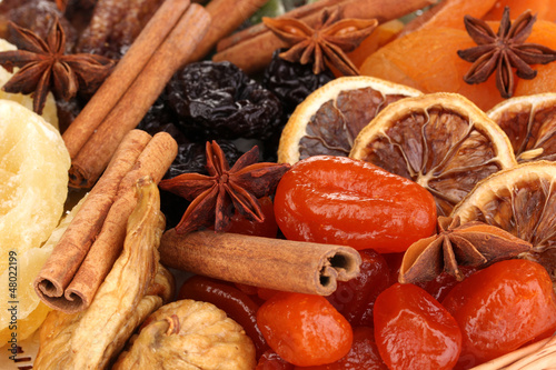 Fototapeta Naklejka Na Ścianę i Meble -  Dried fruits with cinnamon and anise stars close-up