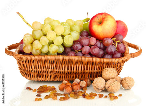 Grape in basket with nuts isolated on white