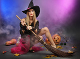 Halloween witch with  broom on color background
