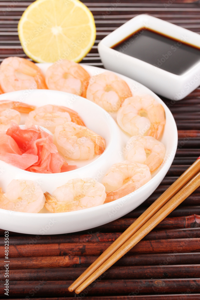 Prawns on plate with chopsticks and sauce Prawns on plate with chopsticks and sauce