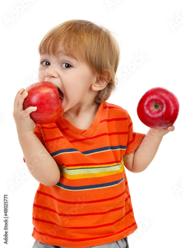 cute little boy eating appl...