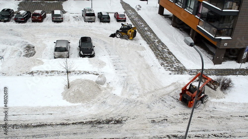 cars stand block house parking tractors clean winter snow