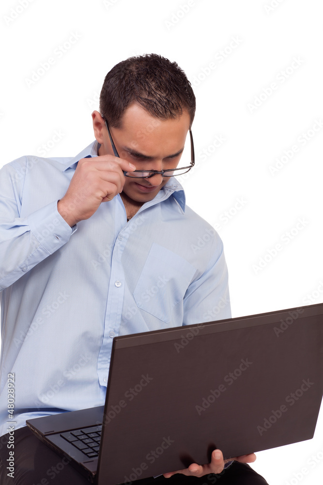Man battling to read his laptop screen Man battling to read his laptop screen