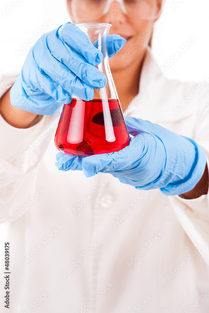 Smiling female scientist holding a beaker of red liquid, isolate Smiling female scientist holding a beaker of red liquid, isolate