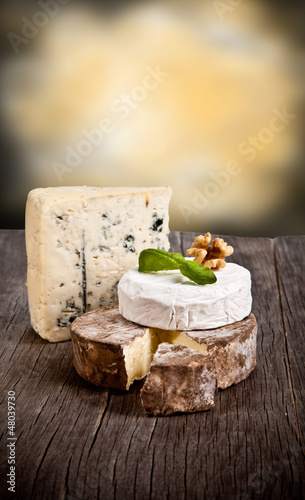 French cheeses on wooden table